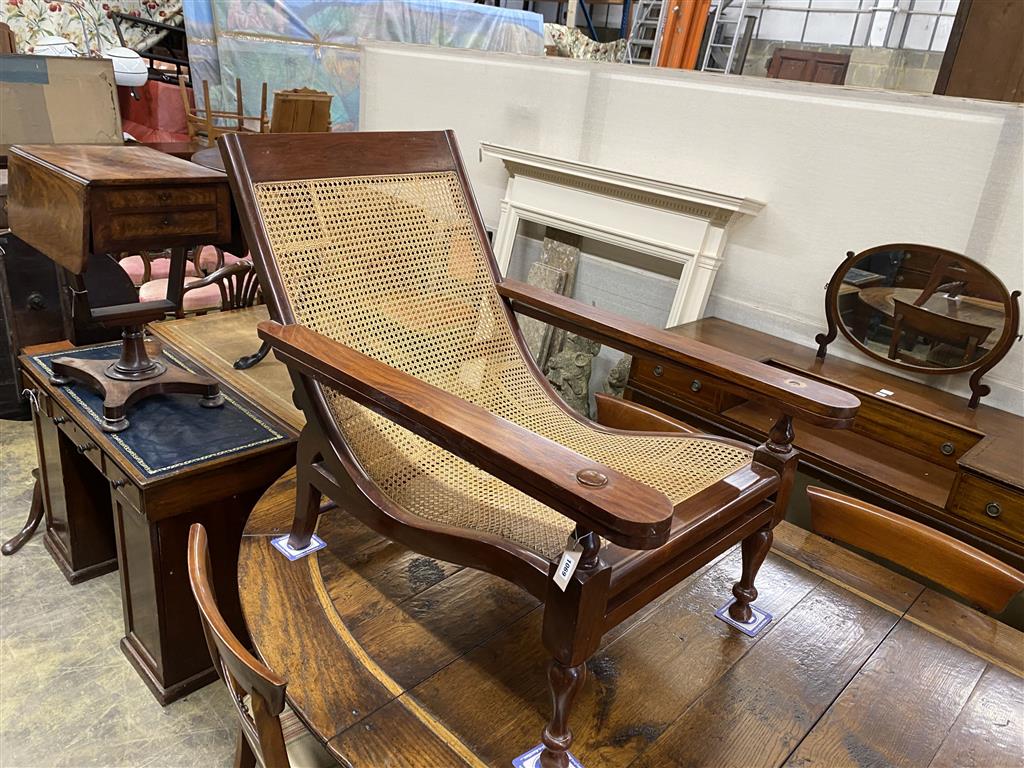 A caned hardwood plantation chair, width 70cm, depth 110cm, height 89cm
